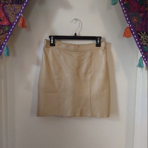 Women&#39;s champagne genuine leather skirt