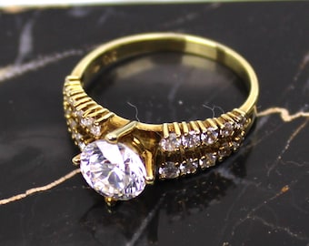 Goldring aus 585er Gelbgold mit Steinbesatz im Brillantschliff (Vintage 14K Gold Ring with brilliant-cut stones)