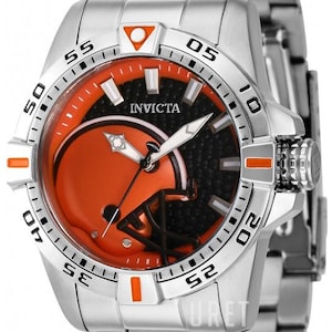 May include: A silver Invicta watch with a round face featuring an orange and black football helmet design. The watch has a silver band and a black textured background. Orange accents are on the bezel.