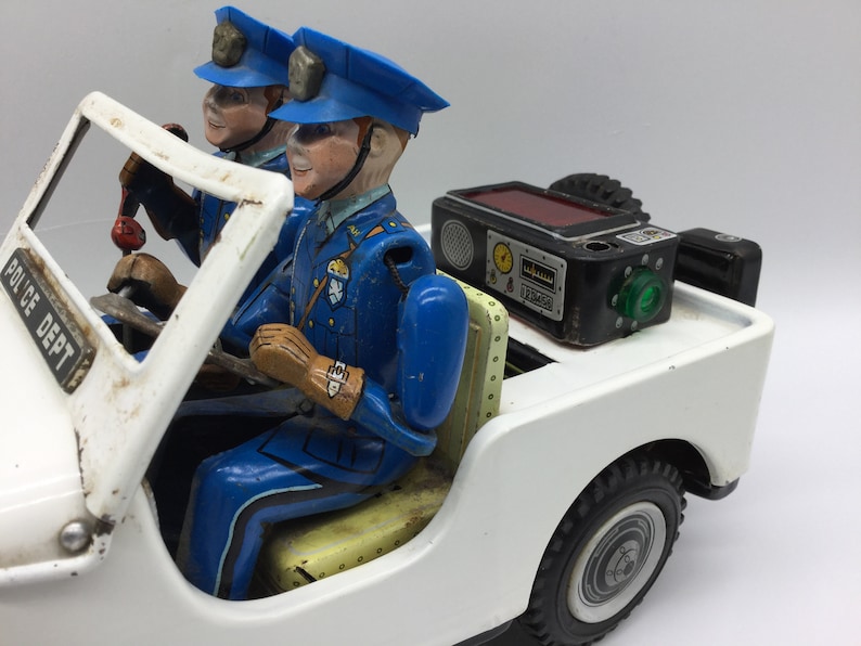 Jeep Police Patrol Nomura Made in Japan jouet en tôle - Miniatures Jeep Police Patrol Nomura Made in Japan jouet en tôle - Miniatures