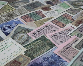 May include: A collection of vintage German banknotes featuring various denominations, including "Fünf Millionen Mark" and "Tausend Mark". The banknotes are in various shades of pink, green, and blue, with intricate designs and text.