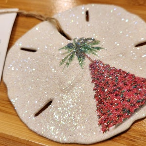 フォートマイヤーズビーチ ポインセチア クリスマスツリーオーナメント、フォートマイヤーズビーチ ハンドペイント サンドダラーオーナメント、FMBStrong