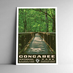May include: A vintage-style poster for Congaree National Park, featuring a wooden boardwalk winding through a lush green forest. The text reads "Congaree National Park, 2.4-mile-long boardwalk loop, Old Growth Bottomland Hardwood Forest."