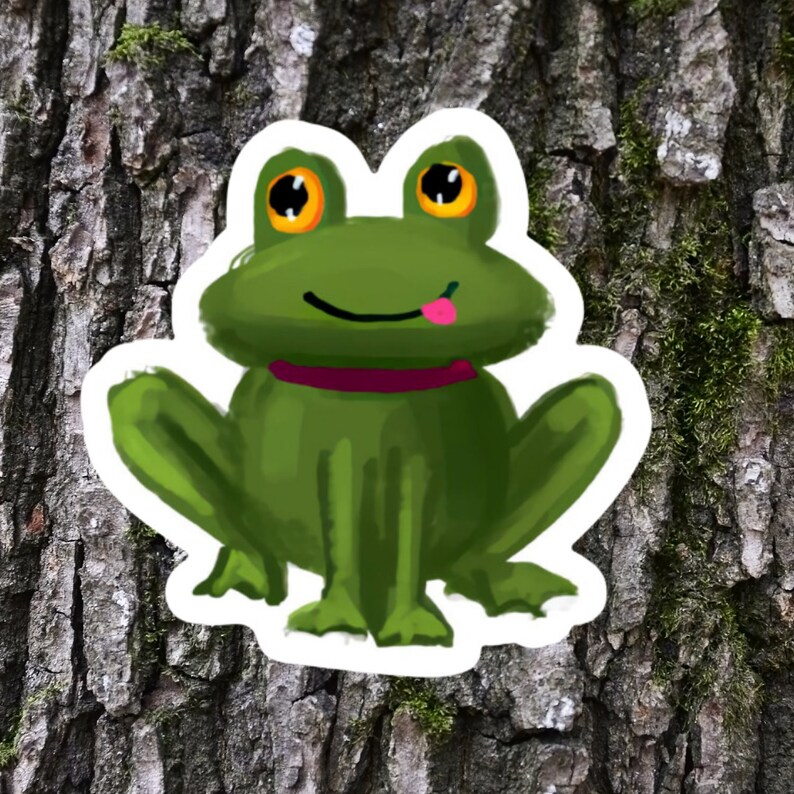 May include: A green frog with big, round, yellow eyes and a pink tongue sticking out. The frog is wearing a pink collar and is sitting on a tree trunk.