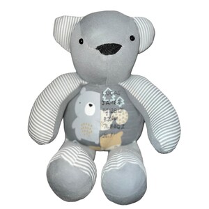 May include: Gray and white striped teddy bear with a personalized patch on its chest. The patch features a bear design with the name "Lucas James", the date "12.12.21", the time "8:28PM", and the weight "7LB 84OZ".