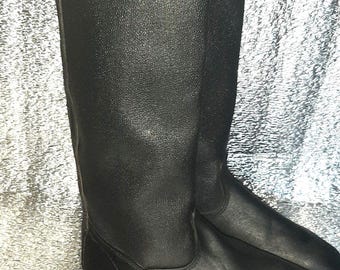 Vintage black kirza tall boots, classic pull-on style, old-era footwear