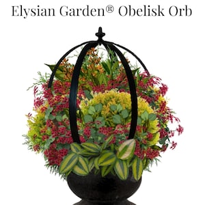 May include: A black metal orb planter with a variety of plants, including red, yellow, and green foliage. The planter is labeled "Elysian Garden® Obelisk Orb".