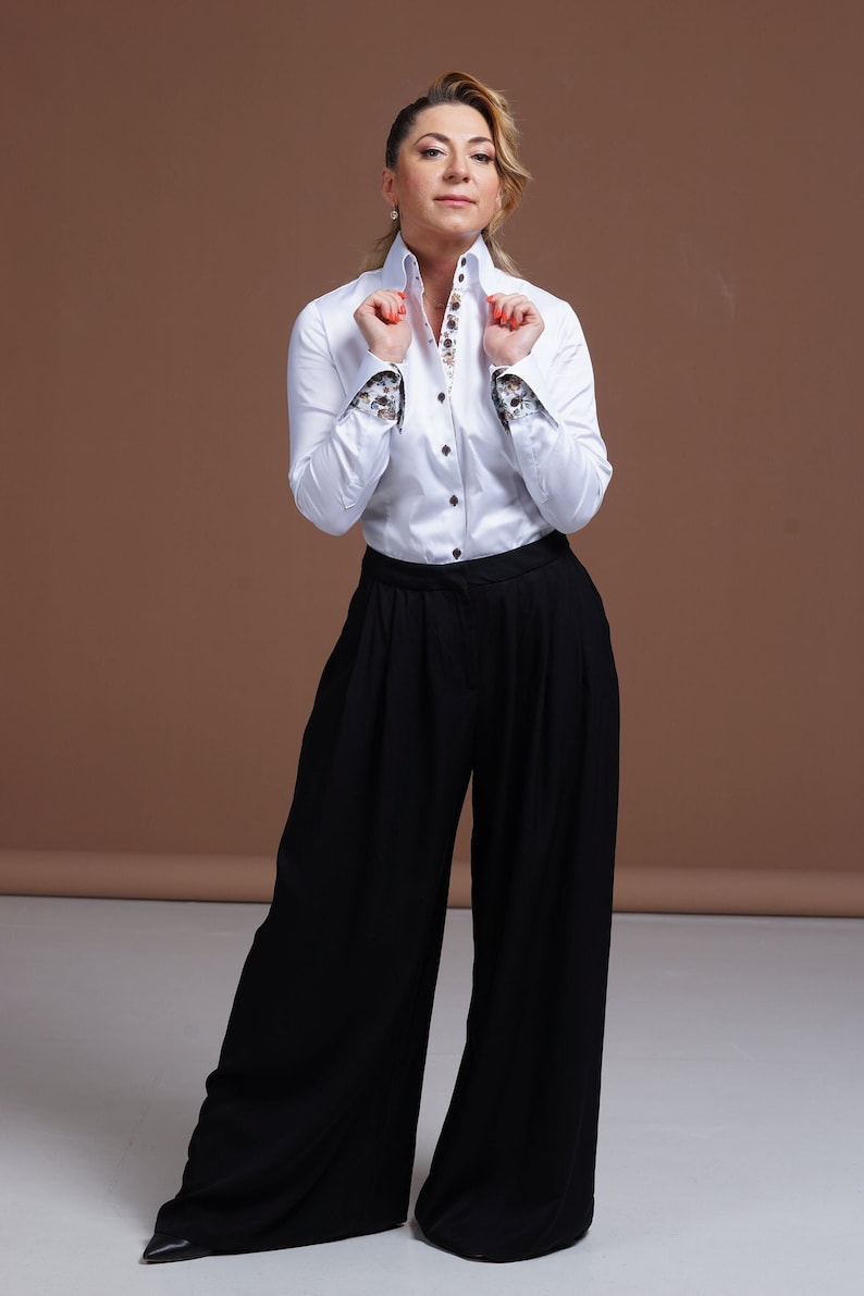 Premium white stretch cotton women's shirt with designer double cuffs and floral details.