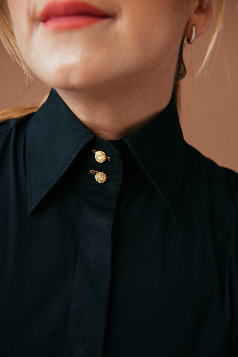 Discover elegance in our Black French Cuff Shirt on Etsy. Crafted from stretch fabric for a slim fit, this dress shirt features French cuffs, a high collar, and gold buttons. Elevate your formalwear with this versatile black blouse for cufflinks.