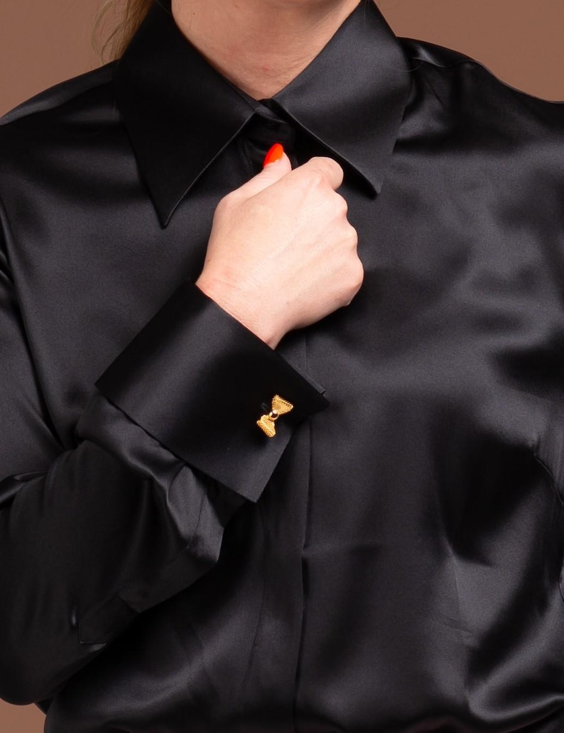 Close-up of Women's Black Silk Blouse with French Cuffs and Hidden Button