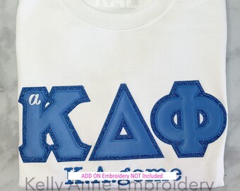 Columbia Blue Greek Letters with Royal Glitter Border on White Sweatshirt