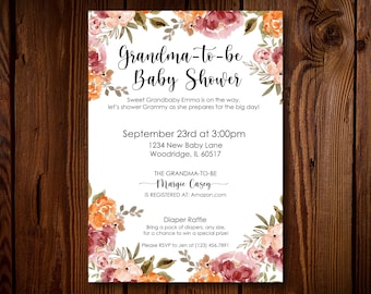 May include: A floral-themed baby shower invitation with a white background and a watercolor design of pink, orange, and green flowers. The text reads "Grandma-to-be Baby Shower" with the date and time of the event, the location, and the name of the guest of honor. The invitation also includes information about a diaper raffle and a request to RSVP.