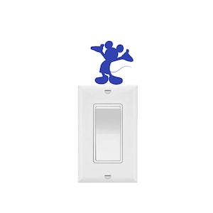 May include: A white light switch with a blue Mickey Mouse silhouette decal on the top.