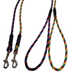 May include: A double dog lead with two black and blue rope leads and one yellow, red and blue rope lead. The leads have black handles and silver clips.