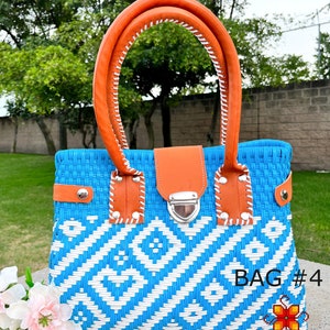 May include: A blue and white woven handbag with orange leather handles and a silver clasp. The bag has a geometric pattern and the text "BAG #4" is visible on the bottom right corner.