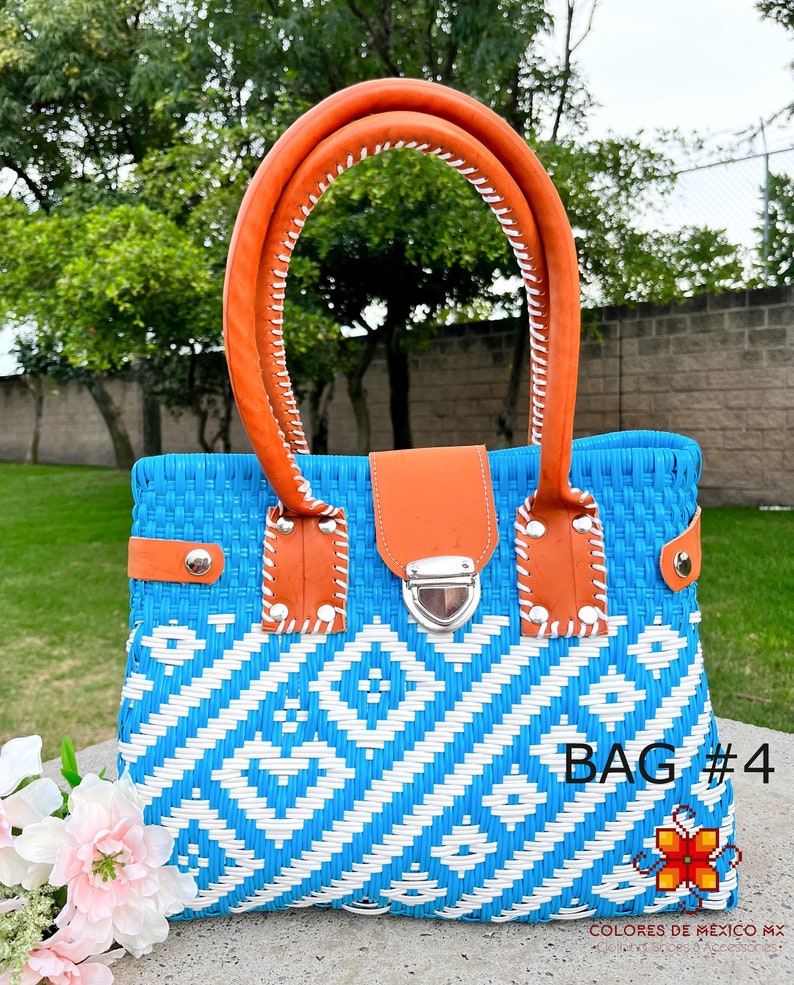 May include: A blue and white woven handbag with orange leather handles and a silver clasp. The bag has a geometric pattern and the text "BAG #4" is visible on the bottom right corner.