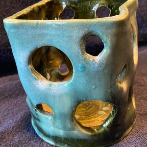 Handmade ceramic cut out candleholder