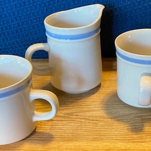Mixed set vintage stoneware cups and creamer