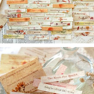 Puede incluir: Una colecci&oacute;n de peque&ntilde;as etiquetas rectangulares de papel con varias citas y refranes inspiradores impresos en ellas. Las etiquetas est&aacute;n decoradas con flores secas y tienen una est&eacute;tica vintage. Las etiquetas est&aacute;n en un frasco de vidrio.