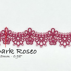 May include: A close-up of a dark rose-colored lace trim with a delicate floral pattern. The trim is 25mm or 0.98 inches wide.