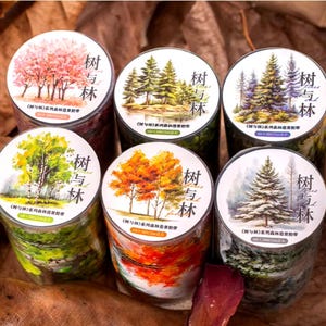 May include: Six rolls of washi tape with different watercolor illustrations of trees and the text "树与林" on each roll. The illustrations include a cherry blossom tree, a birch tree, a maple tree, a pine tree, a fir tree, and a snowy pine tree.