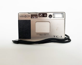 MINOLTA TC-1 — ultra-compact & pocketable TITANIUM premium vintage 35mm film camera, made in Japan (film tested, working, with leather case)