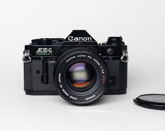 Canon AE-1 PROGRAM film-tested vintage Japanese 35mm Film SLR Camera 1980s — Excellent Condition with f 1:1.4 lens!