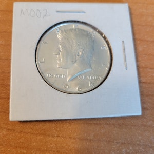 1964 Uncirculated  .90 Silver Kennedy Half Dollar
