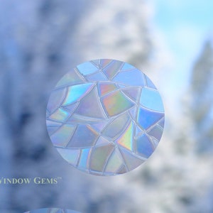 May include: A round, iridescent window film with a geometric pattern. The film is designed to add privacy and style to windows.