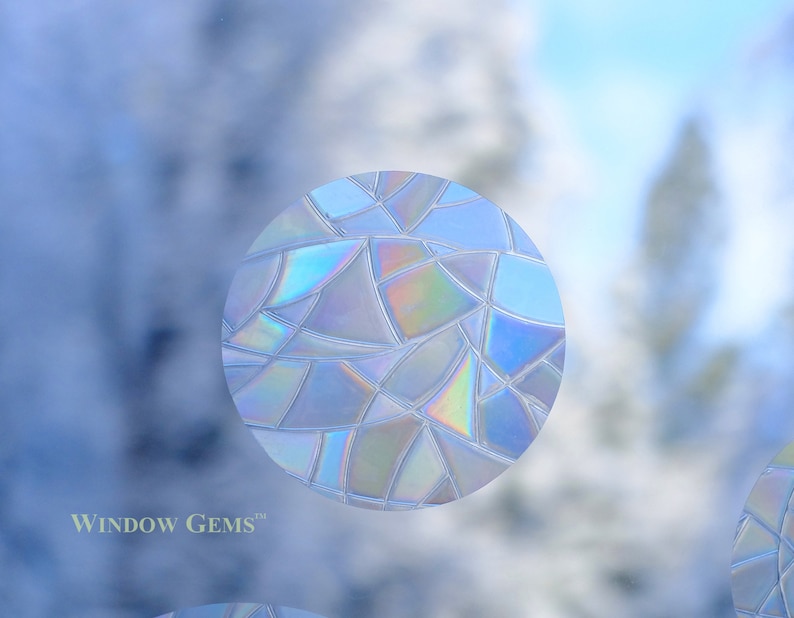 May include: A round, iridescent window film with a geometric pattern. The film is designed to add privacy and style to windows.