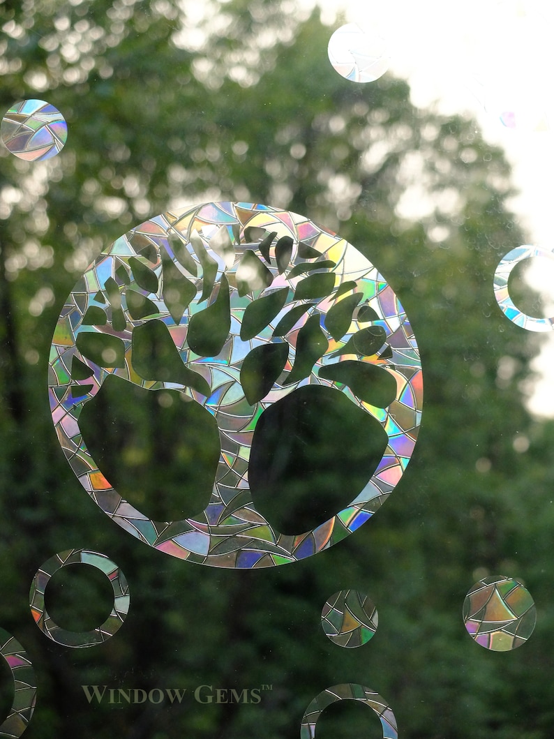 May include: A colorful iridescent window cling featuring a tree of life design. The cling is made of a durable, reusable material and is perfect for adding a touch of nature to any window. The cling is also a great way to add privacy to your home.