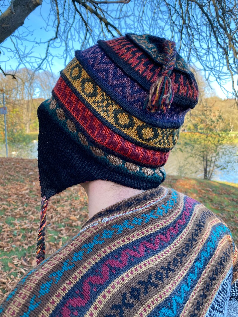 Back view of the model wearing the hat, showcasing the full pattern and fit.