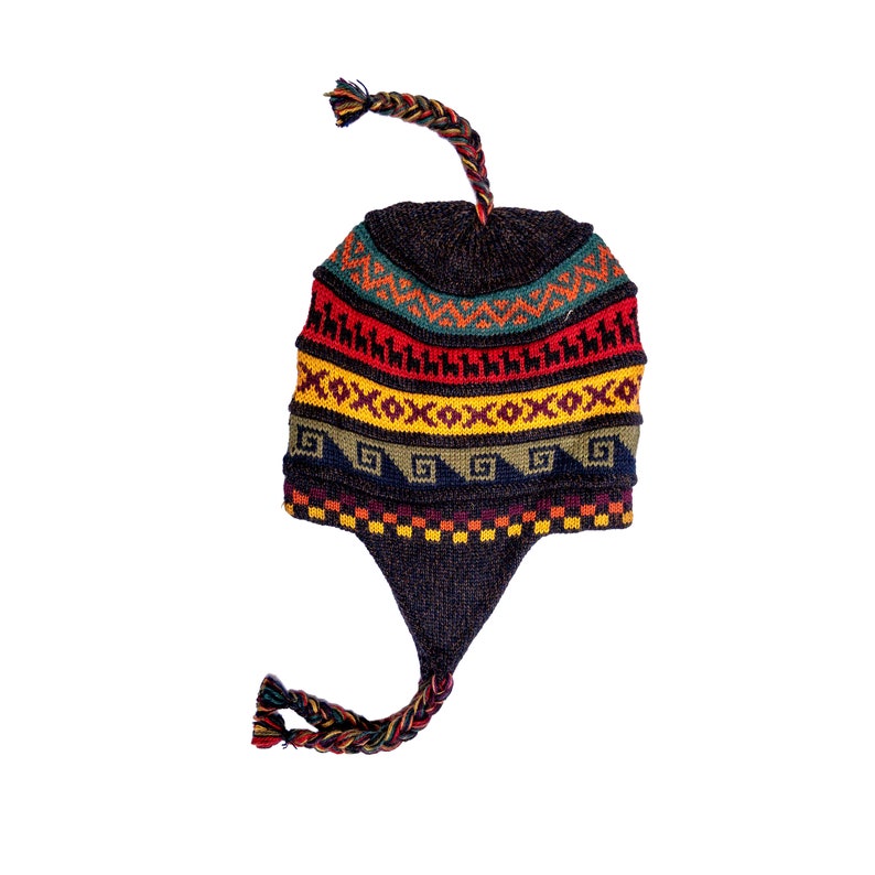 A colorful alpaca wool earflap hat with intricate patterns in red, yellow, green, and navy tones, featuring braided tassels and earflaps, displayed against a white background.