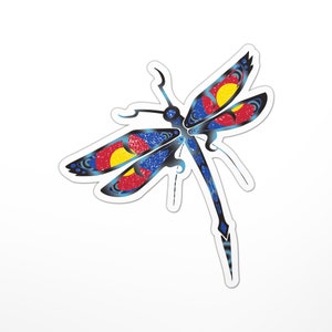 May include: A blue, red, and yellow dragonfly with a distressed, textured finish. The dragonfly's wings are patterned with the colors of the Colorado state flag.