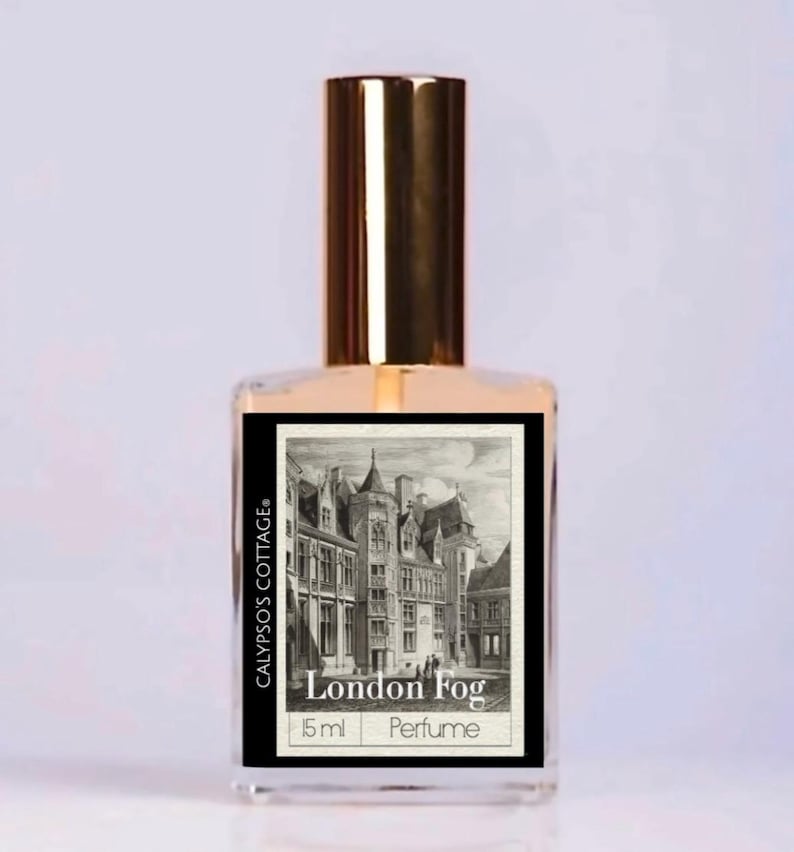 May include: A perfume bottle with a gold cap and a rectangular label featuring a black and white illustration of a building. The label reads "London Fog" and "Calypso's Cottage". The bottle contains 15 ml of perfume.