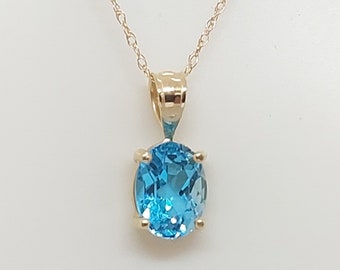Oval Blue Topaz Pendant Necklace: 14k Yellow Gold Rope Chain