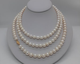 BIAŁY naszyjnik z pereł słodkowodnych o średnicy 7 mm i długości 45 cali z filigranowym zapięciem wykonanym z 14-karatowego żółtego złota.