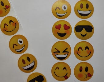 May include: A sheet of yellow emoji stickers with various expressions, including winking, smiling, sunglasses, and hearts. The stickers are 1 inch or 2.5 centimetres in diameter.