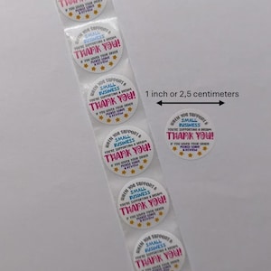 May include: A roll of white, round stickers with the text "When you support a small business, you're supporting a dream. Thank you!" in pink and blue. Each sticker is approximately 1 inch in diameter.