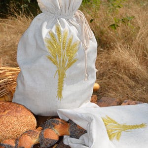 Reusable drawstring double layer linen fabric bread bag with embroidered wheat bundle.