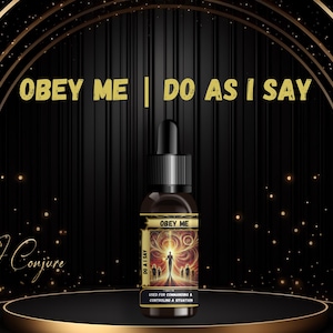 May include: A dark brown glass bottle with a gold label that says "Obey Me" and "Do As I Say". The bottle is on a black and gold stage with a black background. The label also says "Used for Commanding & Controlling a Situation".