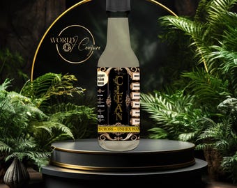 May include: A clear glass bottle with a black label that says "CLEAN" in gold lettering. The label also says "Luxury Floor Wash" and "Ncross - Unihex Wax". The bottle is sitting on a black and gold platform.