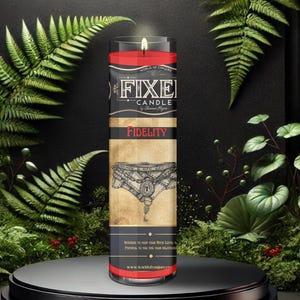 May include: A red candle with a black and white label that says "The Fixer Candle" and "Fidelity". The label also features a black and white illustration of a pair of underwear with a keyhole.