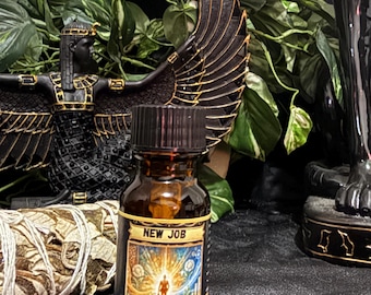 May include: A small amber glass bottle with a black screw cap featuring a label that reads NEW JOB and FOR SUCCESS IN FINDING & KEEPING A JOB. The label displays a graphic of a person walking toward a bright light between two pillars.
