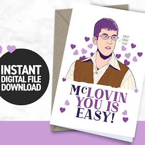 May include: A white card with a purple and brown illustration of a man with purple hair and glasses. The text on the card reads "McLovin You Is Easy!" with purple hearts surrounding the text. The man is saying "CHICA CHICA YEAH!" in a speech bubble.