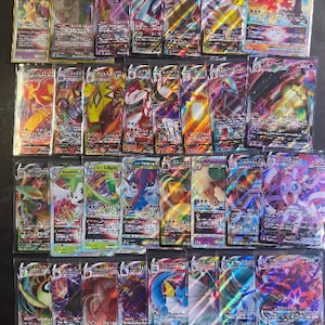 Veel Pokemon-kaarten: 50 kaarten, gegarandeerd Vmax OR VStar Ultra Zeldzaam!