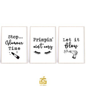 May include: Three black and white printable wall art prints with inspirational quotes about beauty and glamour. The first print says "Stop... Glamour Time" and features a lipstick. The second print says "Primpin' ain't easy" and features eyelashes. The third print says "Let it Blow" and features a hairdryer.