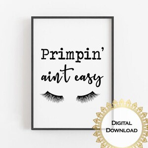 May include: Black and white printable wall art with the text "Primpin' ain't easy" and a pair of eyelashes. The text is in a cursive font.