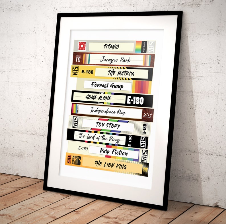 May include: A stack of VHS tapes with titles of popular movies from the 1990s and early 2000s, including Titanic, Jurassic Park, The Matrix, Forrest Gump, Home Alone, Independence Day, Toy Story, The Lord of the Rings, Pulp Fiction, and The Lion King.