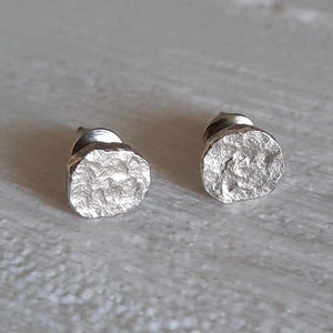 Hammered sterling silver stud earrings.